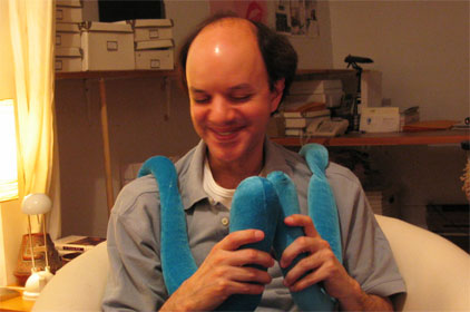 man playing with long blue sacks