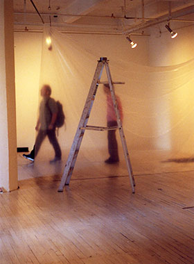 public walking through gallery space