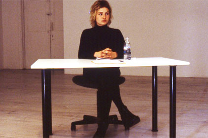 woman sitting in gallery